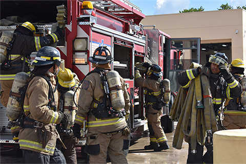 Fire students getting ready to enter their structure burn.